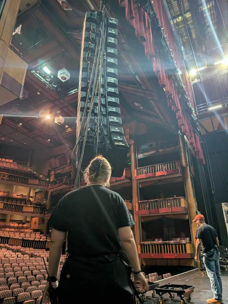 Sarah inspecting the PA line array.