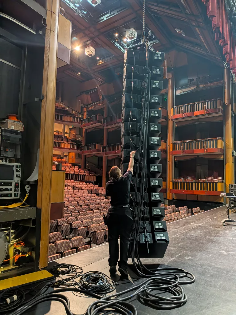 Sarah building the PA line array.