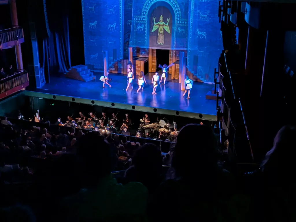 Projection seen mapped on soft goods and flying scenery.