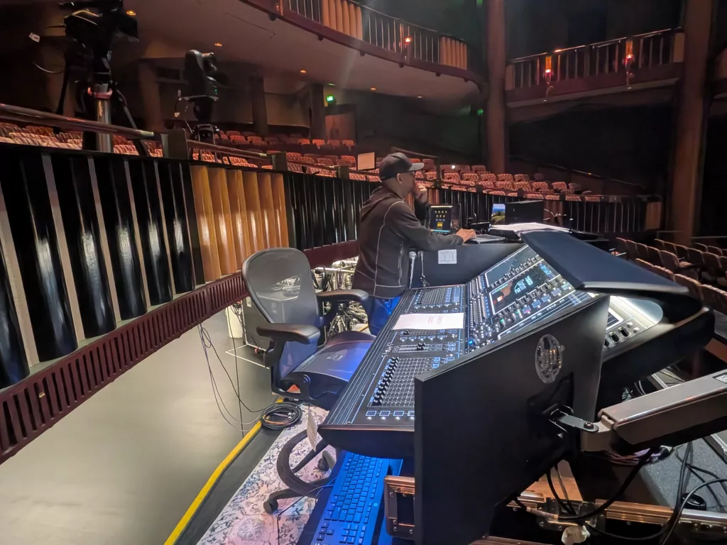 Our FOH audio engineer, Jonny B. getting ready for the event. In the foreground the DIGiiCo Quantum 338 audio desk.
